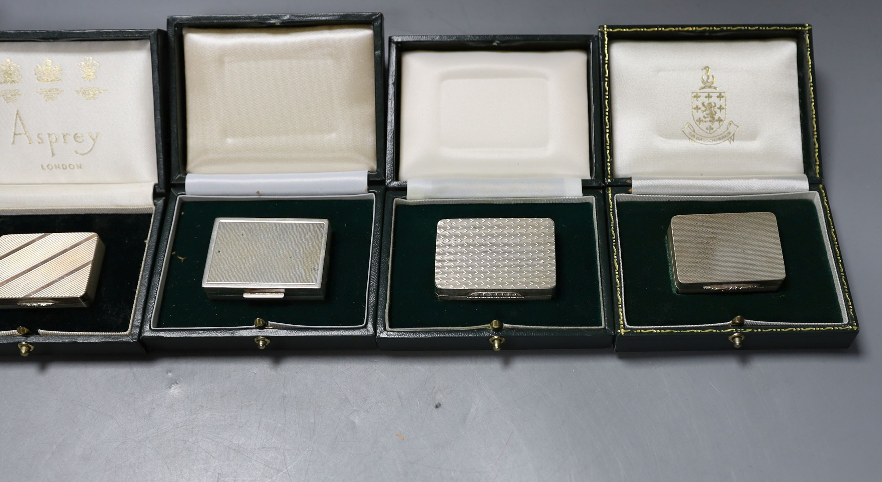 Six assorted modern silver or parcel gilt silver pill boxes by Peter John Doherty, Birmingham, 1965-2000 largest 52mm, all in fitted Gallagher boxes, one by Asprey.